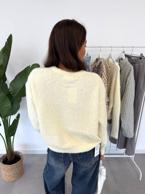 Merel vest – butter yellow vestje met knoopjes en comfortabele pasvorm, achteraanzicht